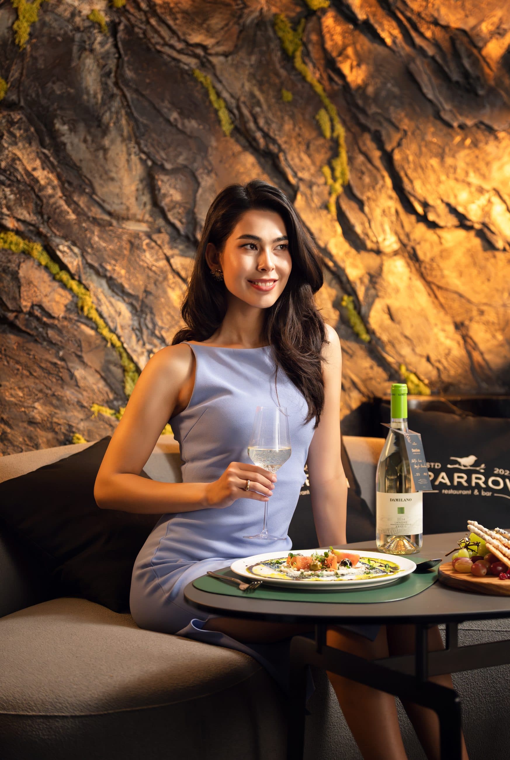 Dining beside the sculpted rock wall in Sparrow's dining room